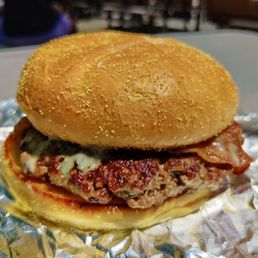 a burger with meat and cheese