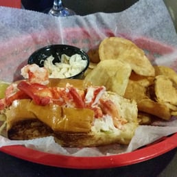 Delicious lobster roll with coleslaw and chips. Yum! Delicious lobster roll with coleslaw and chips. Yum!