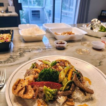 Golden Saigon - The takeout spread! Sesame chicken always a must, with kung pao beef & complimentary cheese rangoon & chicken dumplings. - Vietnamese Near Me - Aurora, Colorado