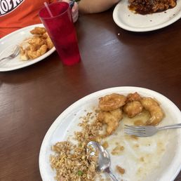 One plate with rice and the other two none