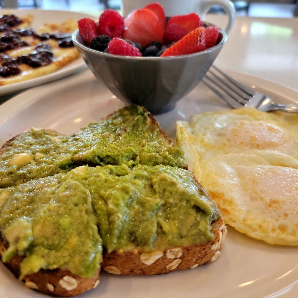 Eggsquisite Cafe - Hummus & Avocado toast, 2 eggs, berry bowl - Breakfast & Brunch Near Me - Frisco, Texas
