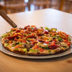 Pizza Place - Small Veggie pizza with artichoke hearts and sun-dried tomatoes