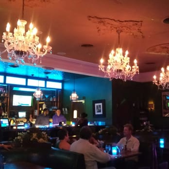 Sidebar - people sitting at a bar with chandeliers - Cocktail Bars Near Me - Las Vegas, Nevada Sidebar - people sitting at a bar with chandeliers - Cocktail Bars Near Me - Las Vegas, Nevada