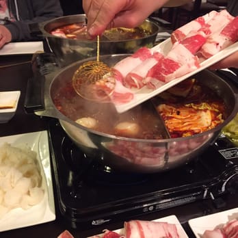 China Garden - Adding the beef slices. They cook very quickly. - Hot Pot Near Me - Omaha, Nebraska China Garden - Adding the beef slices. They cook very quickly. - Hot Pot Near Me - Omaha, Nebraska