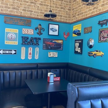Mustang Lucy Cafe - a booth with blue walls and black booths - Cajun/Creole Near Me - Winnsboro, Louisiana Mustang Lucy Cafe - a booth with blue walls and black booths - Cajun/Creole Near Me - Winnsboro, Louisiana