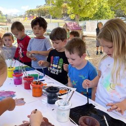 First Baptist Church Hummingbird Preschool - Discovering art outdoors, don't worry about mess, nature will take care of it.