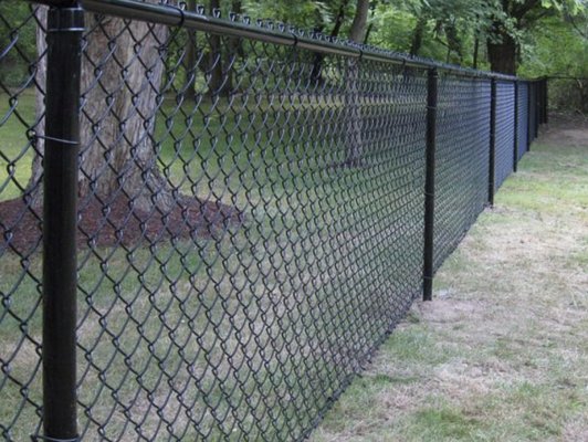 Chain Link Fencing - If you want a chain-link fence, you'll appreciate knowing about the materials we use. Our chain-link fencing:
Is coated in black vinyl to protect against rust
Comes in a variety of sizes
Includes several custom options Chain Link Fencing - If you want a chain-link fence, you'll appreciate knowing about the materials we use. Our chain-link fencing:
Is coated in black vinyl to protect against rust
Comes in a variety of sizes
Includes several custom options