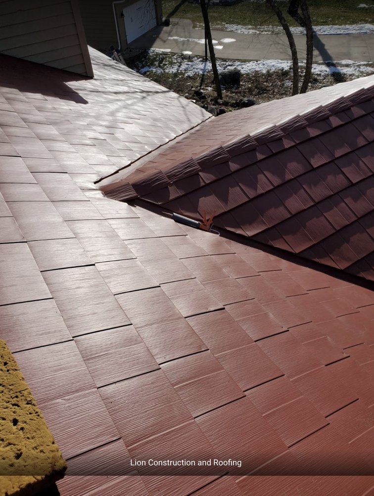 Slide of Lion Construction and Roofing