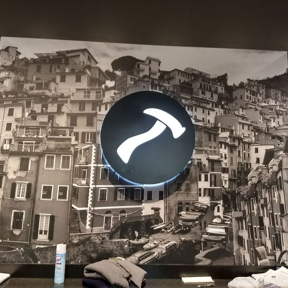Hammer Made - The logo on the rear wall and a photo of the Italian city from which materials are sourced. - Men's Clothing Near Me - Alpharetta, Georgia Hammer Made - The logo on the rear wall and a photo of the Italian city from which materials are sourced. - Men's Clothing Near Me - Alpharetta, Georgia