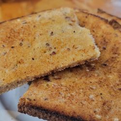 Hearty whole grain & seed bread that was nicely buttered with real butter