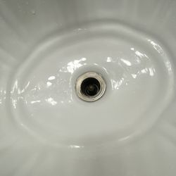 Flamingo Palms Villas - Bathroom sink with no drain cover.