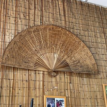 Karihang-Pinoy - a fan on a bamboo wall - Filipino Near Me - Los Angeles, California