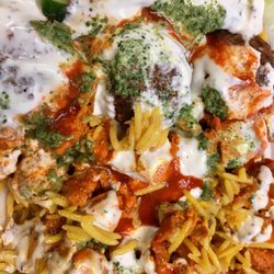 New York Gyro Halal Food - Chicken and falafel on rice..with white red and green sauces!