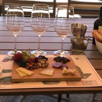 Antica Napa Valley - wine glasses and cheese board - Wineries Near Me - Napa, California