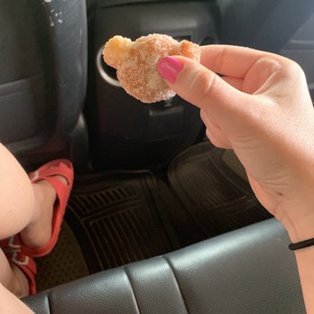 35th & Coffee - a person eating a donut in a car - Coffee & Tea Near Me - Menominee, Michigan 35th & Coffee - a person eating a donut in a car - Coffee & Tea Near Me - Menominee, Michigan
