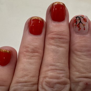 Angel Nail Bar - My Lunar New Year manicure w/red & gold polish & a special nail w/cherry blossoms! - Nail Salons Near Me - Orange, California