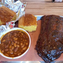 Half slab, baked beans, and corn bread. Needed an extra to take home. It's so good. Half slab, baked beans, and corn bread. Needed an extra to take home. It's so good.