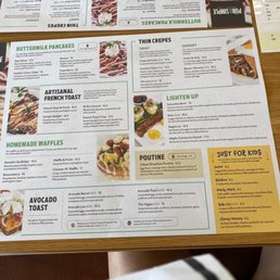 a restaurant menu on a table a restaurant menu on a table