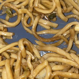 a plate of noodles and mushrooms