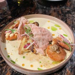 Pan-seared scallop, arare crusted shrimp, and shellfish Beurre Monte