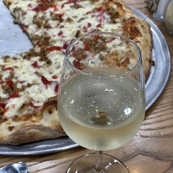 Black Cat Pizzeria - Decent selection of wine  and very yummy Medium BYO pizza that could feed an army. Their prices are very reasonable! - Pizza Near Me - Yulee, Florida
