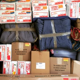 Note box marked "Fragile" that is turned sideways and buried under tons of other boxes and furniture. Note box marked "Fragile" that is turned sideways and buried under tons of other boxes and furniture.