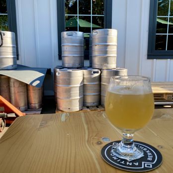 Antimony Brewing - a glass of beer on a table - Bars Near Me - Lenox, Massachusetts
