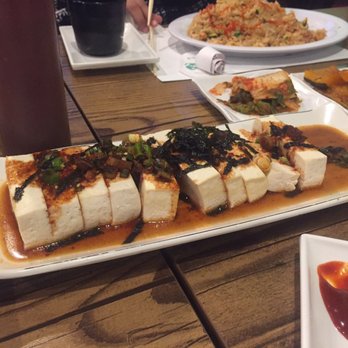 Koreana - Yangnyum tofu, which is steamed tofu with soy-garlic sauce, garnished with seaweed and spring onions. - Korean Near Me - Schaumburg, Illinois