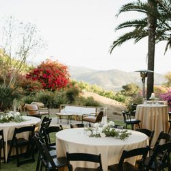 Event Party Rentals - Black Resin Folding Chair with Pad + 60" Round Table + Poly 120" Round in Champagne + Teak Wood Sofa + Camel Leather Lounge Chair