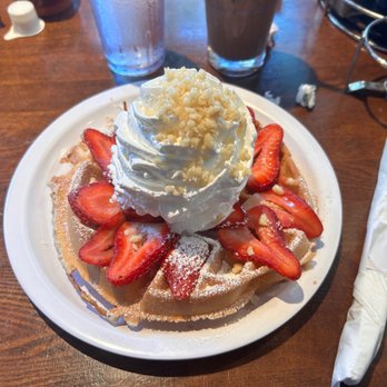 Eggs 'n Things Ko Olina - Mochi waffle with fresh  Strawberry Whipped Cream and macadamia topping. It was delicious, I thought I wouldn't be full after eating it. - American Near Me - Kapolei, Hawaii