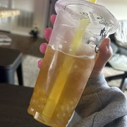 Pineapple fruit tea with lychee popping boba!