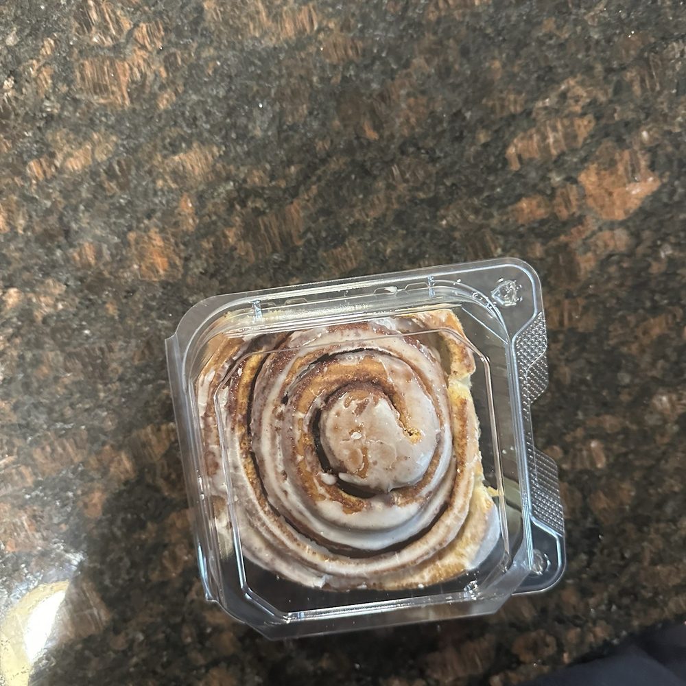 The cinnamon roll, which used to be covered generously with white icing, now barely has any at all.