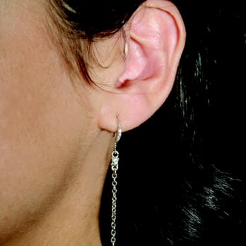 Hearing Lab - Receiver-in-Canal hearing aids sit behind your ear with a thin tube that delivers sound to your eardrum. - Hearing Aid Providers Near Me - Glenview, Illinois