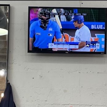 She's Got the Tools - Tv mounted at Lion's Mane Grooming co barbershop in little Italy - Handyman Near Me