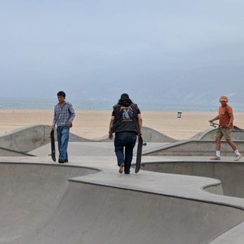 Venice Beach Boardwalk - Skateboard park also famous, this hardcore guy is as skating barefoot - Beaches Near Me - Venice, California