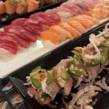 Sake 2 Me Sushi - only food pic of the night: (back to front) Roly Poly, Holiday, Sushi: tuna, yellowtail, salmon, peppered salmon, Crispy Yellowtail Roll - Sushi Bars Near Me - Cerritos, California Sake 2 Me Sushi - only food pic of the night: (back to front) Roly Poly, Holiday, Sushi: tuna, yellowtail, salmon, peppered salmon, Crispy Yellowtail Roll - Sushi Bars Near Me - Cerritos, California