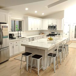 Urban Floors - Kitchen remodel. Design, hardwood flooring, paint, counter top, island and cupboard installation by Urban Floors.