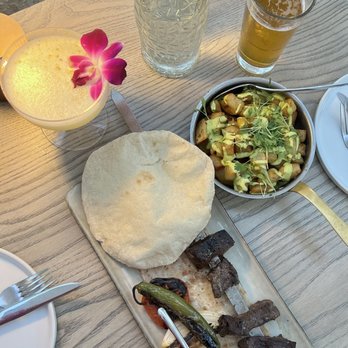 Laya Restaurant - Wagyu Kebab and Batata Hara with Ambrosia cocktail which - Mediterranean Near Me - Los Angeles, California Laya Restaurant - Wagyu Kebab and Batata Hara with Ambrosia cocktail which - Mediterranean Near Me - Los Angeles, California