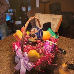 Dale's Flowers from the Heart - This is the basket I received. The grass was actually red. This is not primarily fruit. This looks like an Easter basket! Not for a funeral.