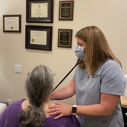 Glacier Direct Primary Care - Dr. Tabor-Manaker listening to a patient's heart and lungs.