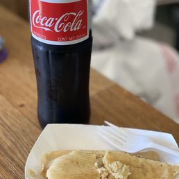 Chicken tamale with salsa verde and an ice cold Mexican coke. Yum! Chicken tamale with salsa verde and an ice cold Mexican coke. Yum!