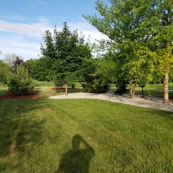 Two Brothers Landscaping - the shadow of a man on a lawn - Landscaping Near Me Two Brothers Landscaping - the shadow of a man on a lawn - Landscaping Near Me