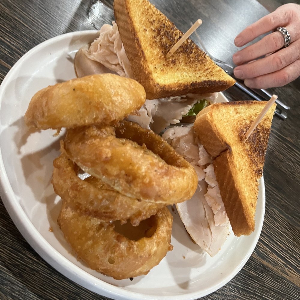 Mad Cow - Turkey club sandwich with onion rings - Burgers Near Me - Eagan, Minnesota Mad Cow - Turkey club sandwich with onion rings - Burgers Near Me - Eagan, Minnesota