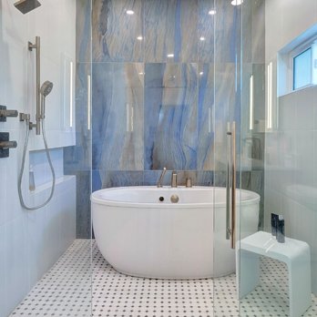 St. Augustine Home Improvements - St. Augustine bathroom remodel by St. Augustine Home Improvements! Freestanding tub pops against blue tile walls in this luxury renovation. - General Contractors Near Me - Saint Augustine, Florida St. Augustine Home Improvements - St. Augustine bathroom remodel by St. Augustine Home Improvements! Freestanding tub pops against blue tile walls in this luxury renovation. - General Contractors Near Me - Saint Augustine, Florida