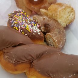 In our family we like to cut our donuts in half and share different pieces In our family we like to cut our donuts in half and share different pieces