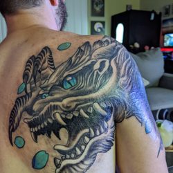 East Coast Worldwide Tattoo & Piercing - Back photo.