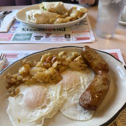 Paul & Christa's Diner & Family Restaurant - Back: philly cheesesteak wrap with egg and homefries Front: 2 eggs over easy with sausage links and homefries