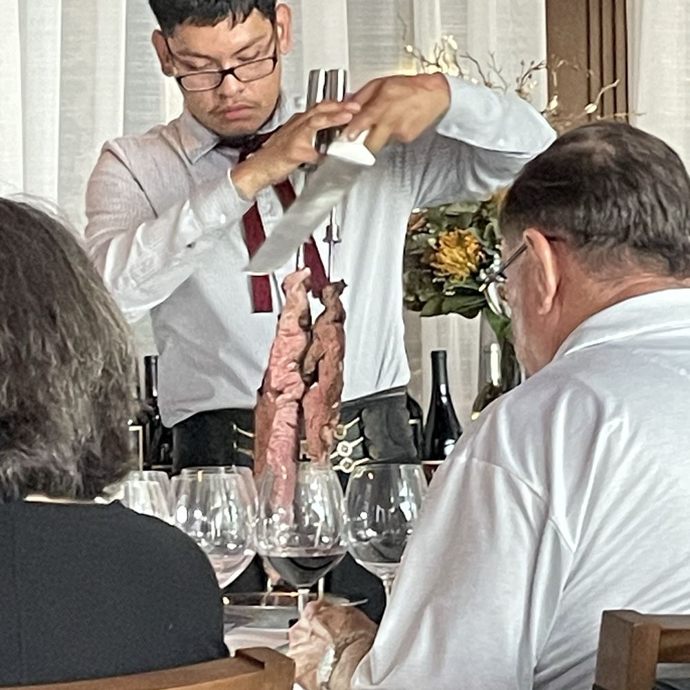 Fogo de Chão - Server about to carve meat - Brazilian Near Me - San Antonio, Texas