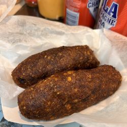 Aqui Me Quedo Restaurant - Alcapurrias de Guineo con carne de cerdo (Fried banana stuffed with pork.)