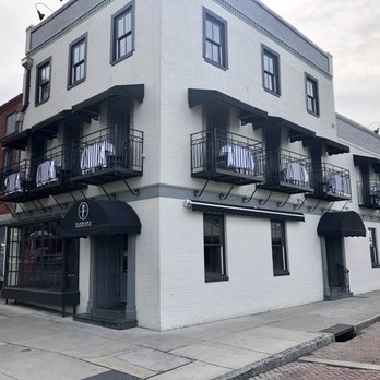 Floriana - Exterior showing entrance and outside tables on upper level. - Bars Near Me - Wilmington, North Carolina